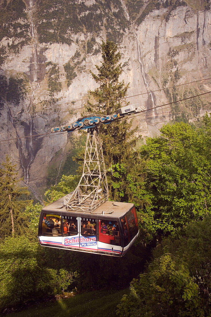 Fully occupied cabin of the Schilthornbahn on the way from Gimmelwald to Schilthorn, Gimmelwald near Mürren, Bernese Oberland (highlands), Canton of Bern, Switzerland