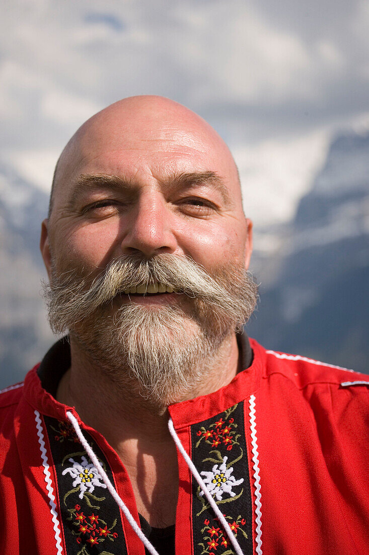 Swiss man smiling at camera, Portrait, Bussalp (1800 m), Grindelwald, Bernese Oberland (highlands), Canton of Bern, Switzerland