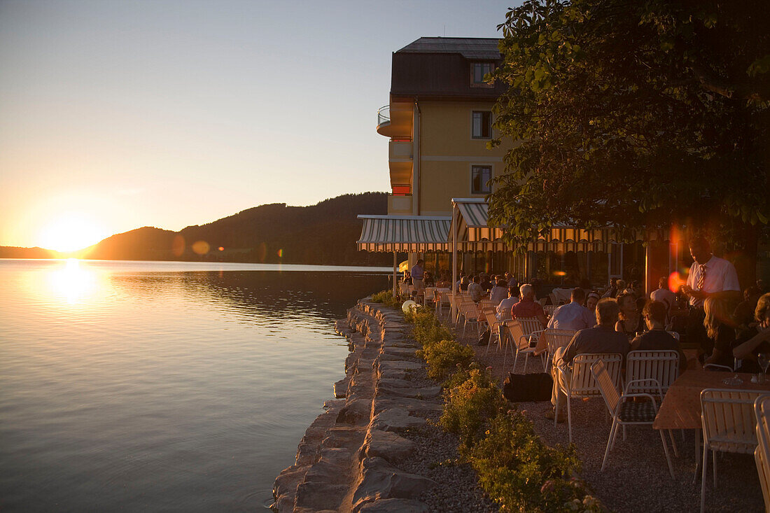 Open air area of a restaurant at Lake Fuschl in the evening, Fuschl am See, Salzkammergut, Salzburg, Austria