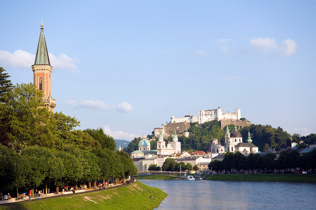 View along Salzach to Hohensalzburg Fortress, largest, fully-preserved fortress in central Europe, with Salzburg Cathedral and Collegiate Church, built by Johann Bernhard Fischer von Erlach at right side and Christ Church at left side, Salzburg, Salzburg,