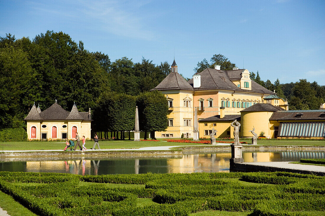 View over water parterre to Hellbrunn Palace and Crown Grotto, Salzburg, Salzburg, Austria