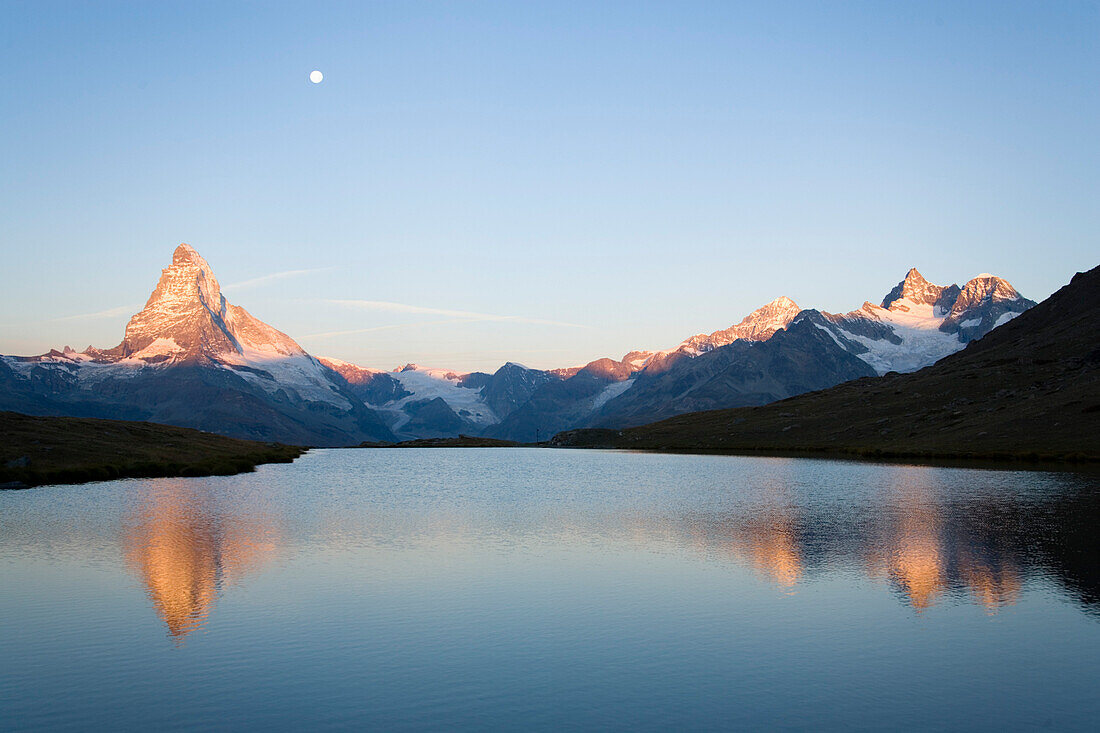 Matterhorn 4478 m, reflected in Lake Grindjisee 2334 m, at sunrise, Zermatt, Valais, Switzerland