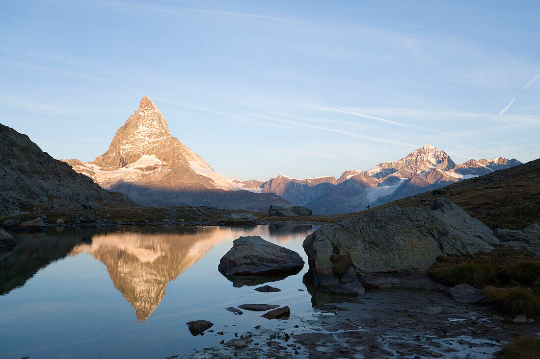 East side (Hörnligrat) of Matterhorn (4478 m) reflected in Riffelsee, Zermatt, Valais, Switzerland