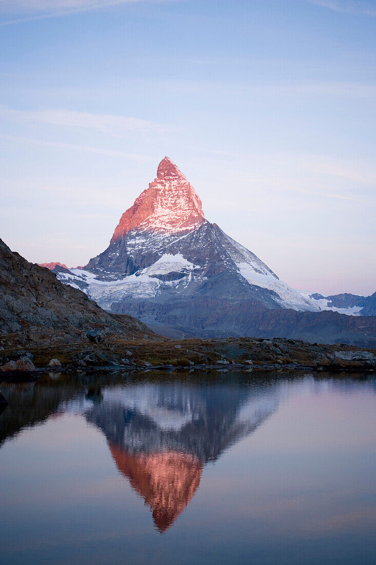 East side (Hörnligrat) of Matterhorn (4478 m) reflected in Riffelsee, Zermatt, Valais, Switzerland