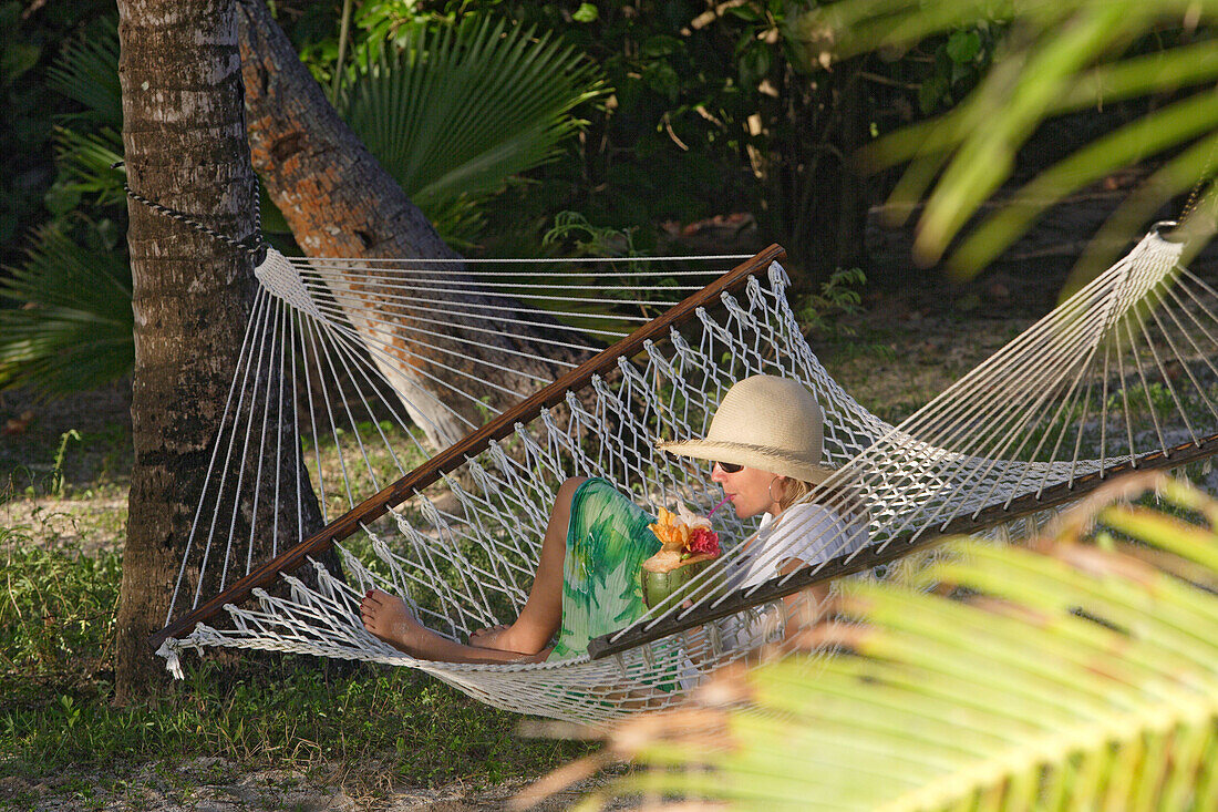 Woman with Drink in Hammock, Tonga, South Seas