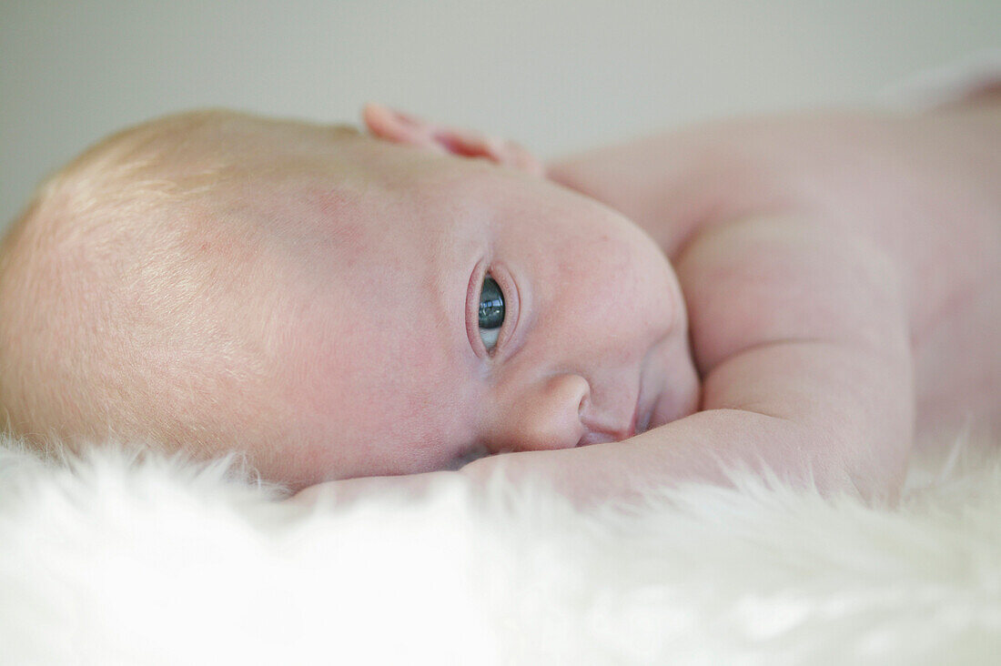 Baby lying on blanket