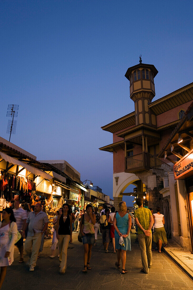 People strolling over shopping street Odos Sokratous in the evening, Rhodes Town, Rhodes, Greece, (Since 1988 part of the UNESCO World Heritage Site)