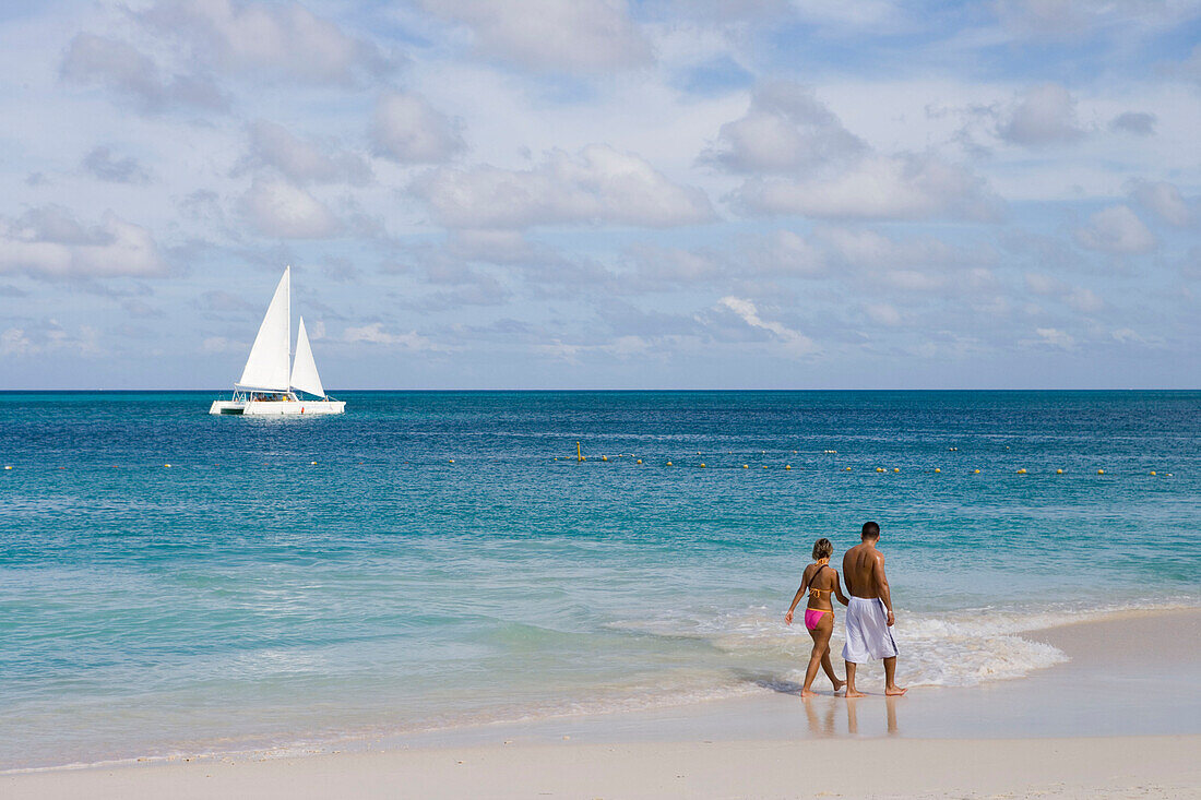 Catamaran and Couple on Eagle Beach, Aruba, Dutch Caribbean