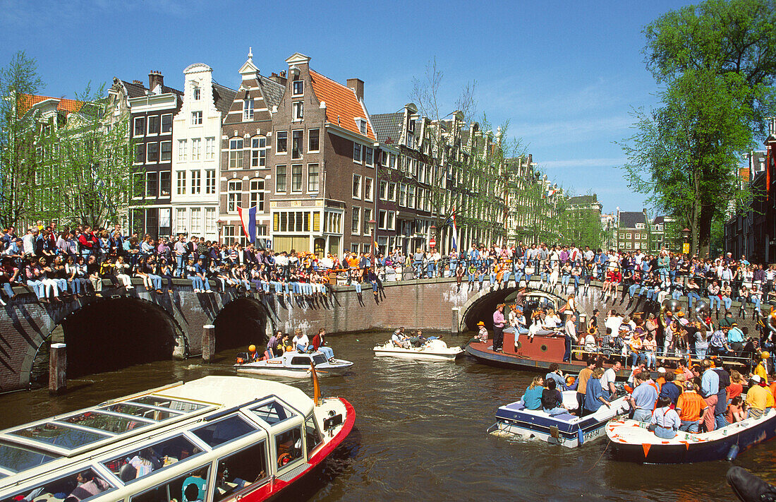 Amsterdam, Jourdan, party boats on canal at queens birthday