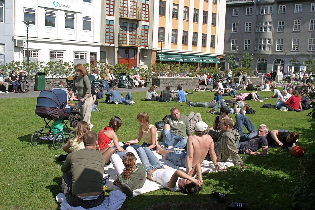 Iceland, Reykjavik, center, people relaxing in a small park in summer