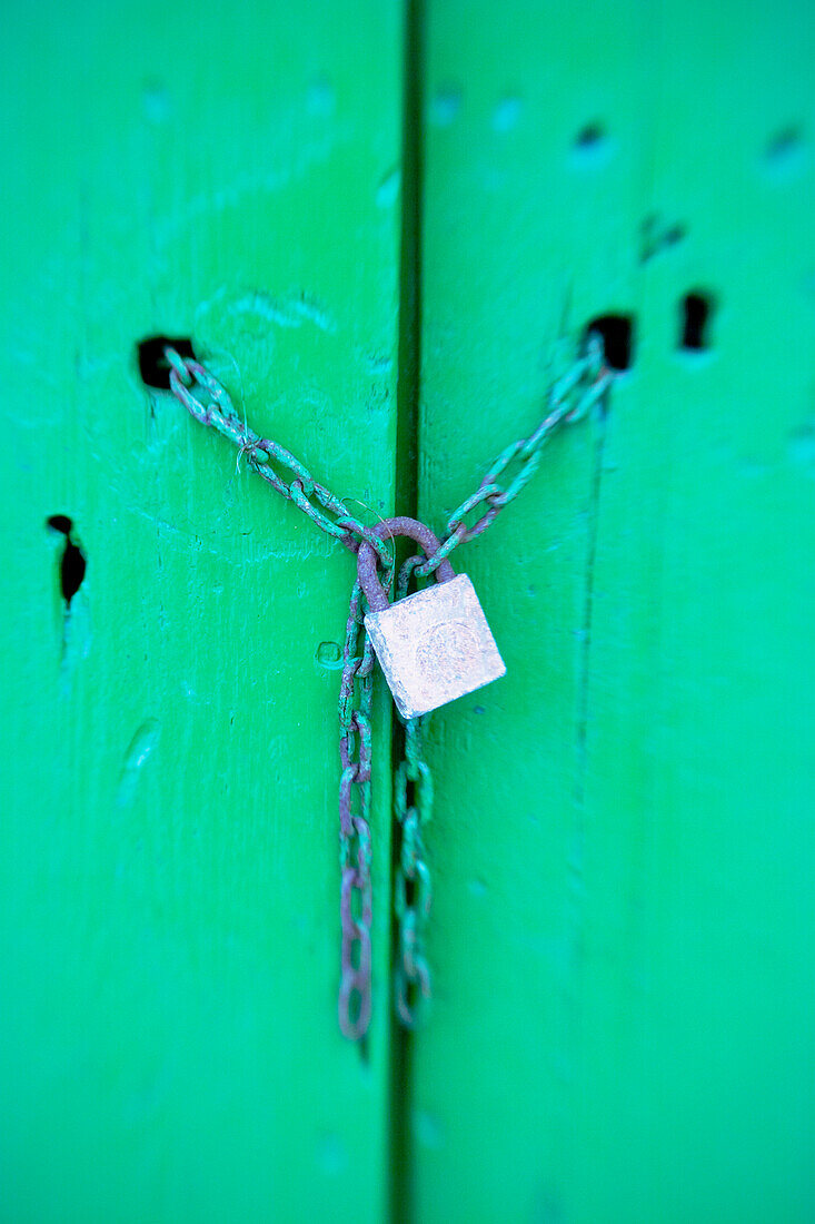 Green door with chained lock, Cala Figura, Mallorca