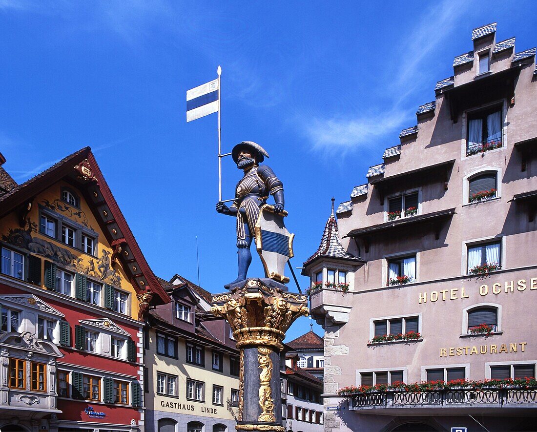 Switzerland, Zug, fountain statue, typical architecture, old city center