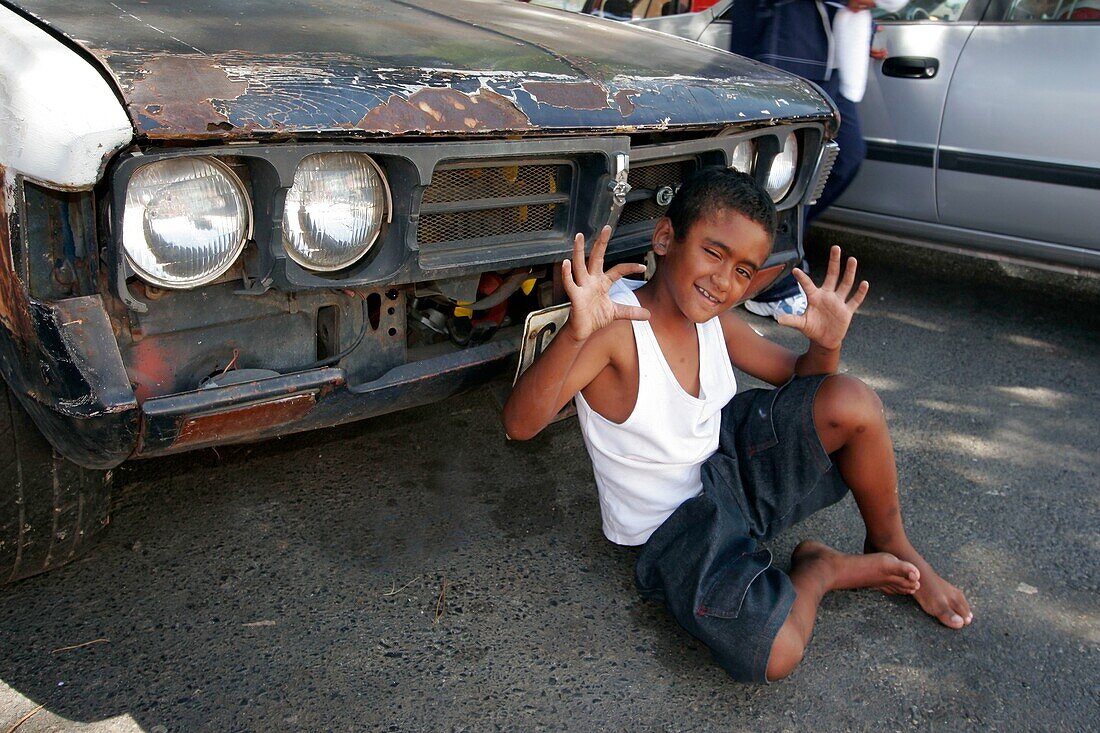 Boy in front of old car, Bo Kaap, Cape Town, South Africa
