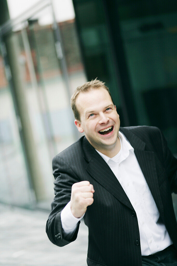 A business man cheering