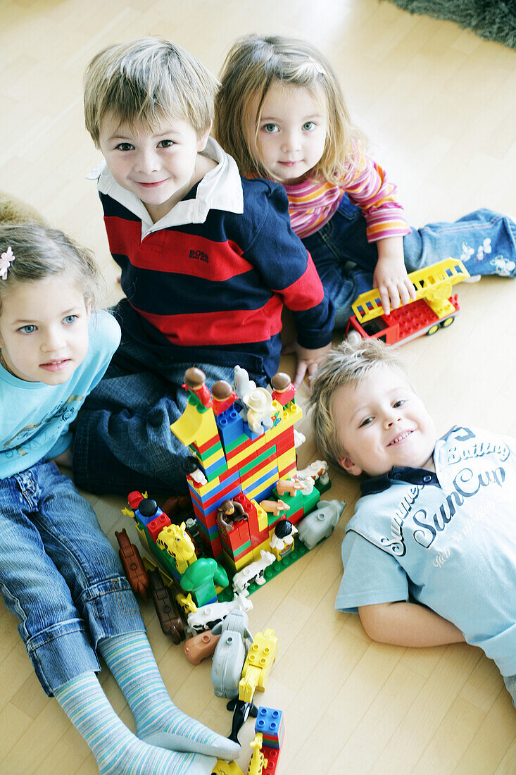 Children playing with plastic bricks