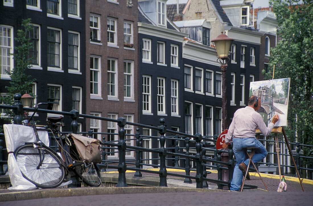 Painter at Reguliersgracht, Amsterdam, Netherlands, Europe