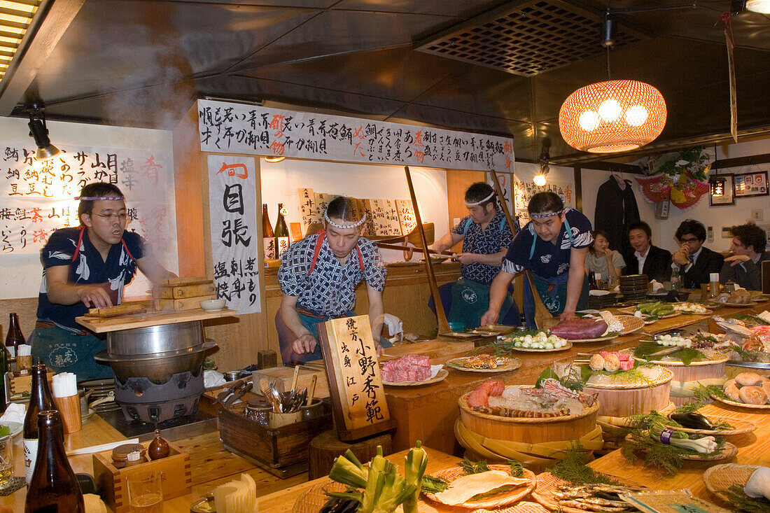 Waiters and guests in a traditional restaurant, Tokyo, Japan, Asia