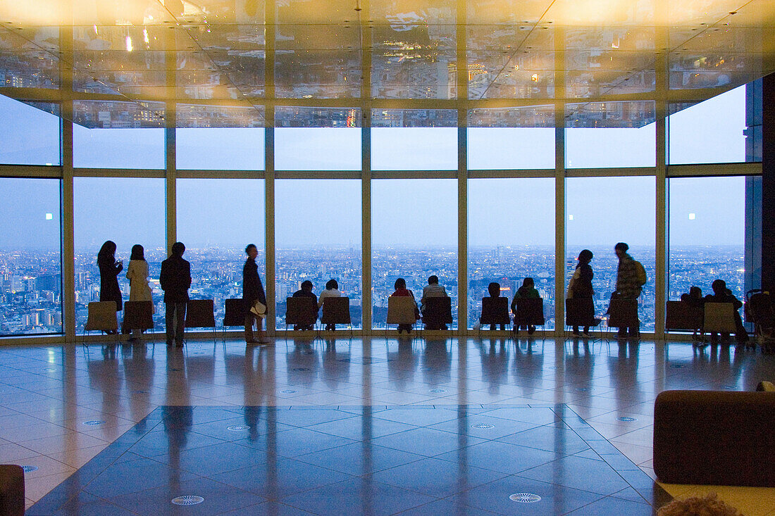 People enjoying city view from Mori Tower, Roppongi Hills, Tokyo, Japan