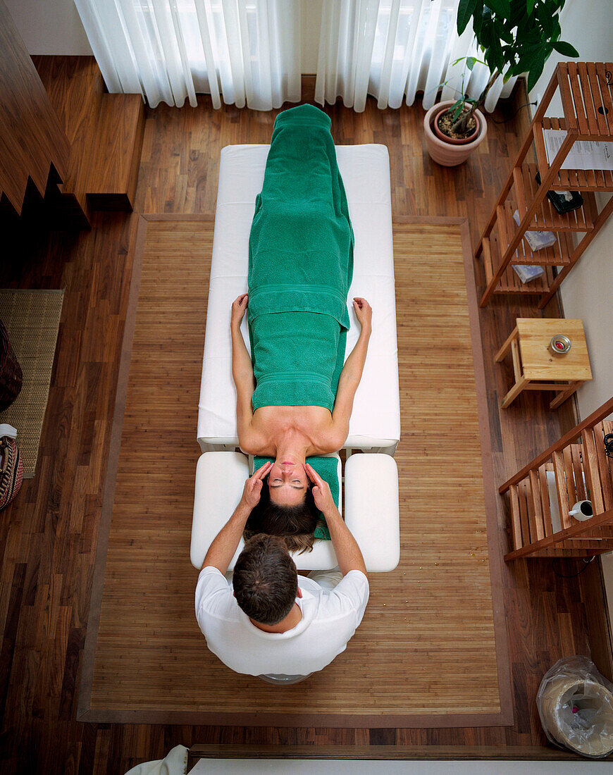 Woman having an Ayurvedic head massage, Spa area, Spa Hotel Seehotel Neuklostersee, Mecklenburg Western Pomerania, Germany