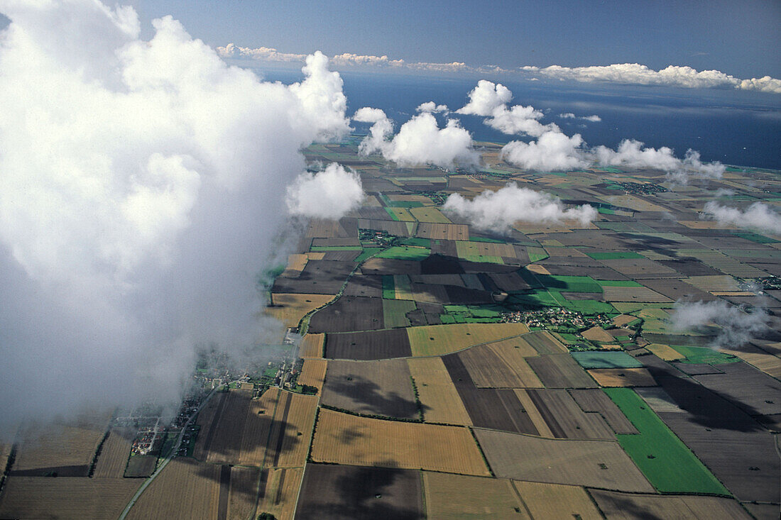 aerial photo of Fehmarn island, patchwork fileds, clouds, Baltic Sea, Schleswig Holstein, northern Germany