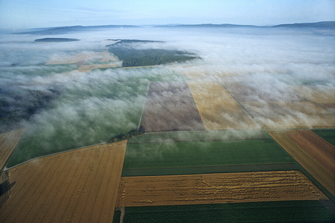 Fog over Weserbergland landscape, Lower Saxony, Germany