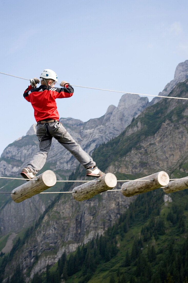 Boy in Central Switzerland's largest rope park, Frägmüntegg, Lucerne, Canton of Lucerne, Switzerland