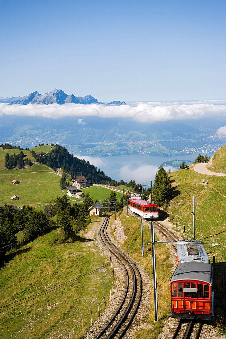 View over Rigi Kulm (1797 m) with rack railway Vitznau Rigi Bahn, the first mountain railway of Europe, mountain panorama with mount Pilatus (2132 m) in background, Rigi Kulm, Canton of Schwyz, Switzerland