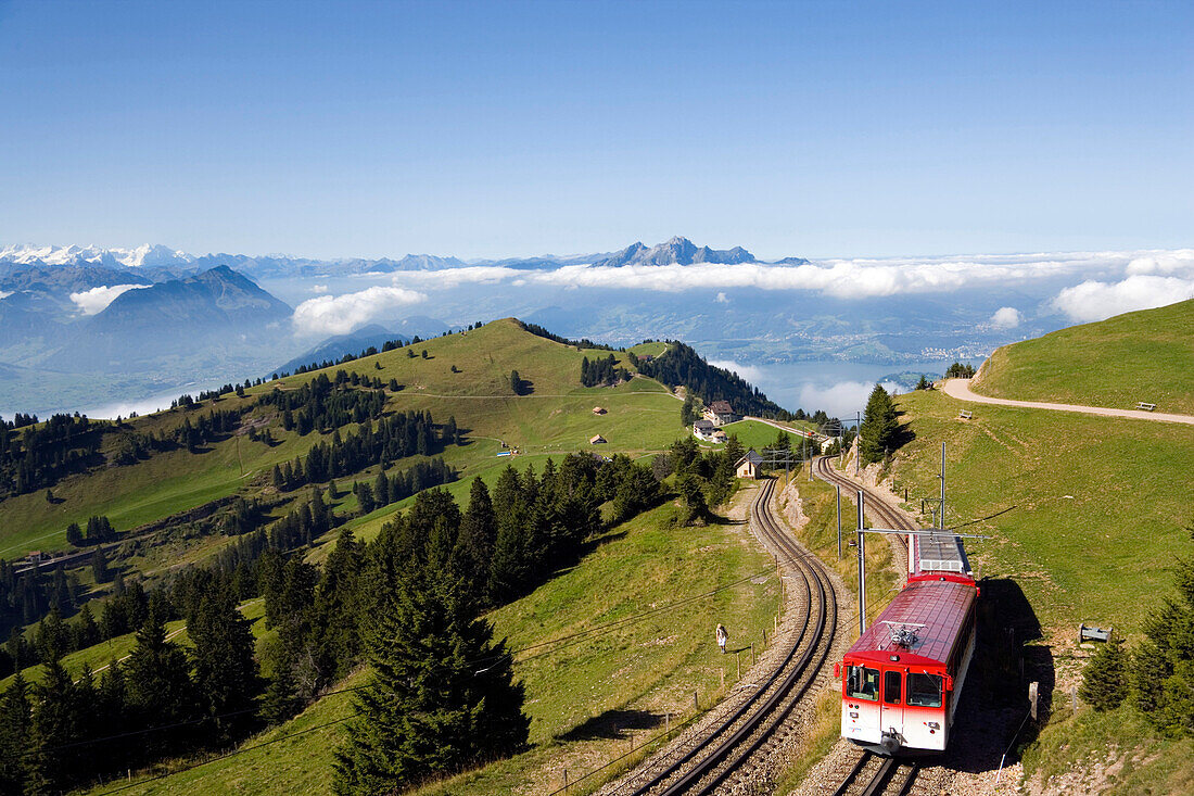 View over Rigi Kulm (1797 m) with rack railway Vitznau Rigi Bahn, the first mountain railway of Europe, mountain panorama with mount Pilatus (2132 m) in background, Rigi Kulm, Canton of Schwyz, Switzerland