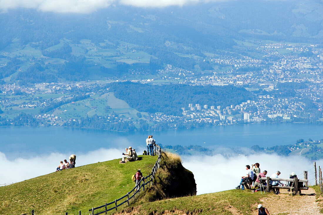 People on Rigi Kulm (1797 m) enjoying view over Lake Lucerne to Pilatus (2132 m), Rigi Kulm, Canton of Schwyz, Switzerland