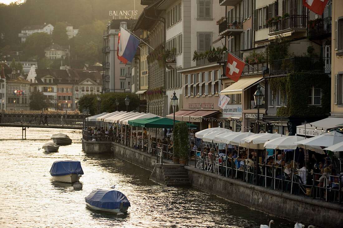 View along the river Reuss with pavement cafes at Rathausquai, Lucerne, Canton of Lucerne, Switzerland