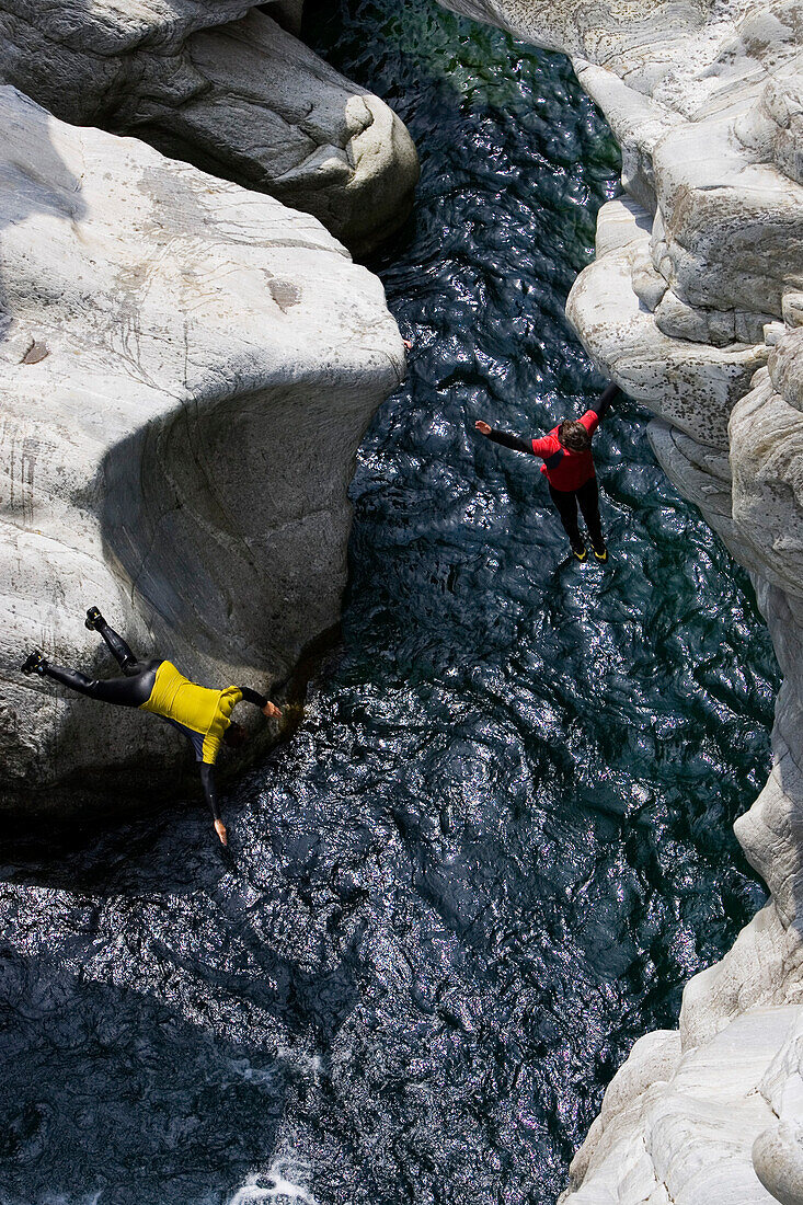 Young woman canyoning, Valle Maggia, Canton of Ticino, Switzerland, MR