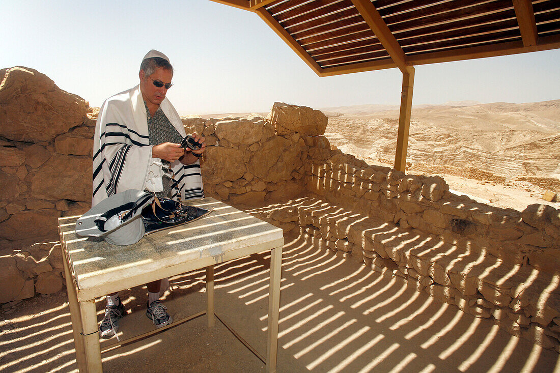 A Jewish man preparing for praying, Masada, Dead Sea, Israel