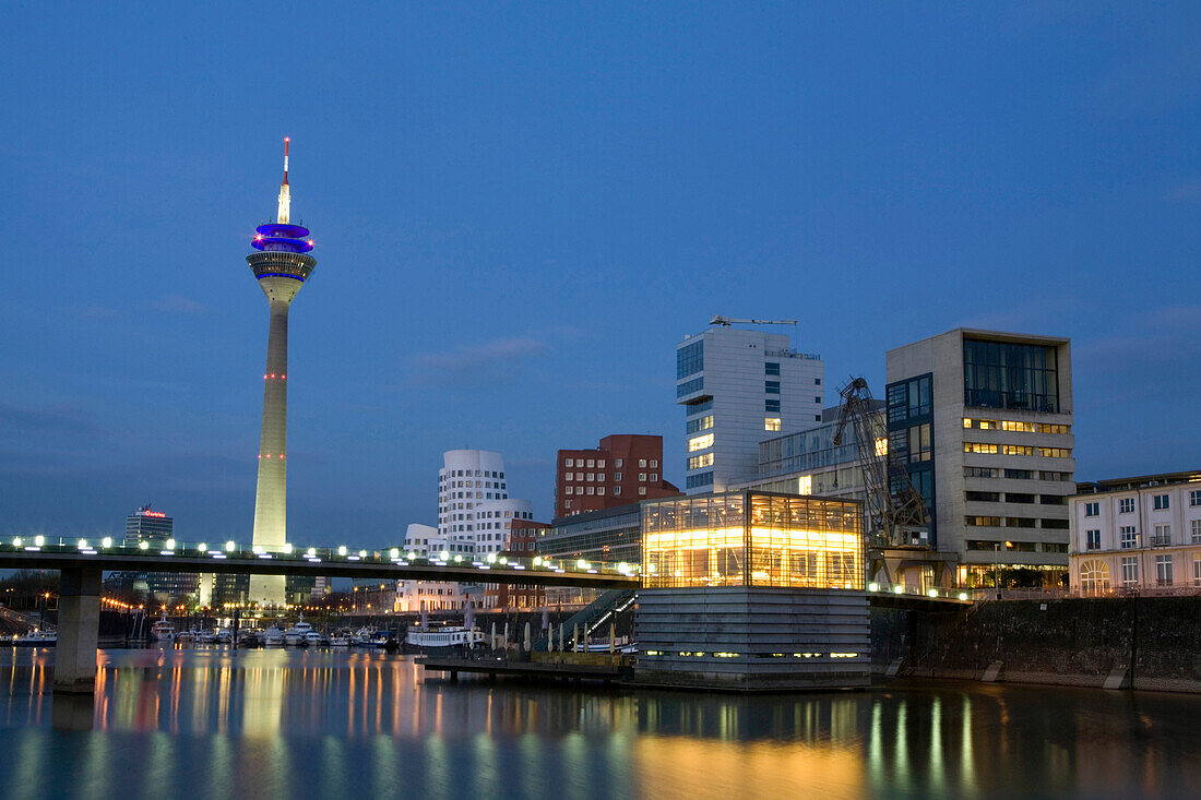 Modern architecture in the Media Harbour with television tower in the evening, Düsseldorf, state capital of NRW, North-Rhine-Westphalia, Germany