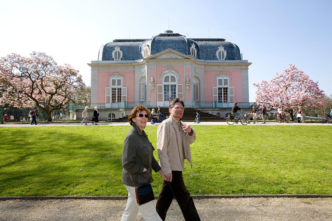 Mature adult couple walking hand in hand at Benrath castle, Düsseldorf, state capital of NRW, North-Rhine-Westphalia, Germany