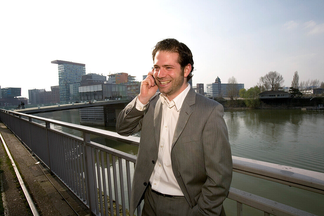 young buisness man in the district of media, new district of Düsseldorf, harbor, state capital of NRW, North-Rhine-Westphalia, Germany