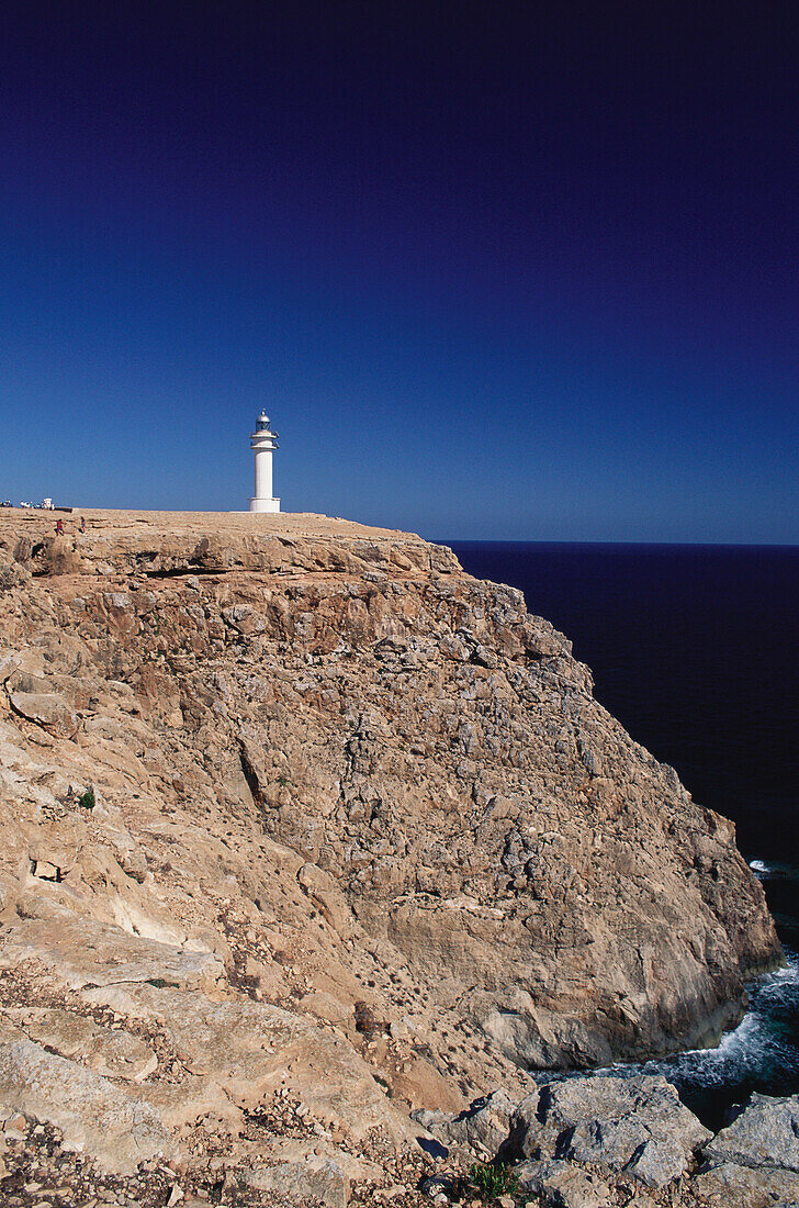 Lighthouse on rocky coast, Cap de Barbaria, Formentera, Spain