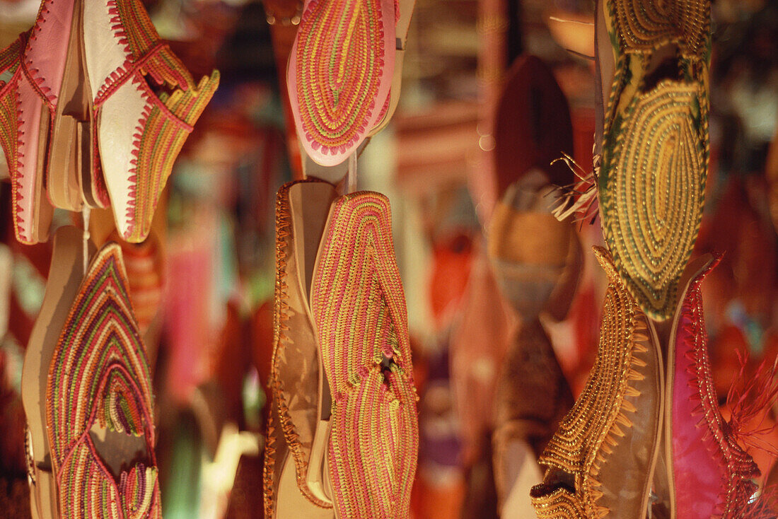 Sandals, shoes and Babouche hung up at a market stall, Marrakech, Marocco, Africa