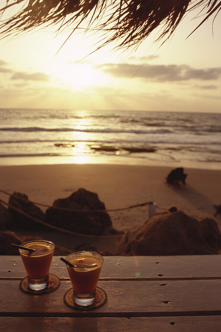Drinks at sunset on beach, Tel-Aviv, Israel