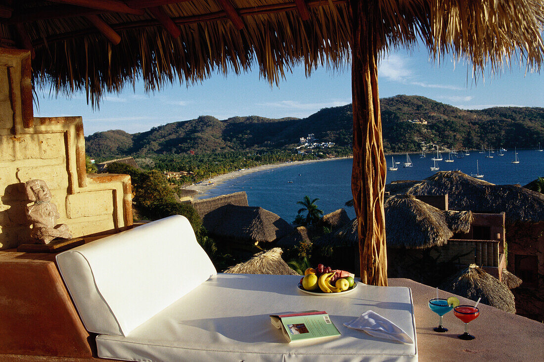 Sun lounger with cocktails and fresh fruit, small  luxury hotel, La Casa que canta Zihuatanejo, Guerrero, Mexico, America