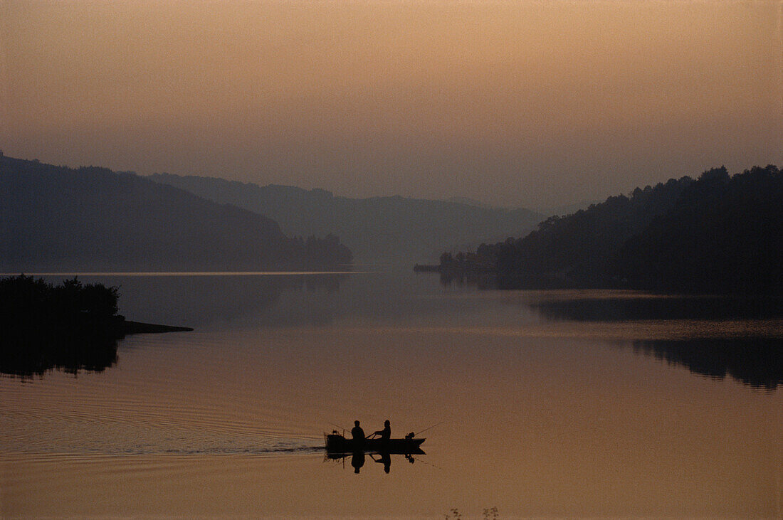 Two Fishermen in a boat on Sauer Reservoir, Luxembourg