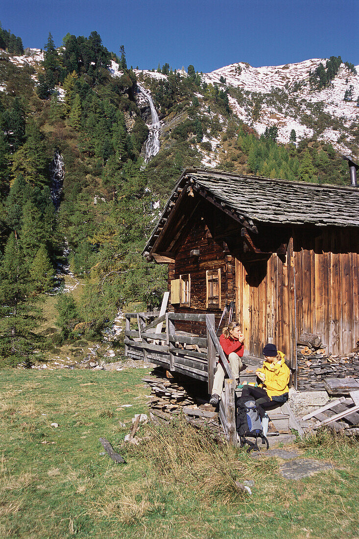 Two people having a lunch break, Dorfertal, Natural Park Hohe Tauern, Austria