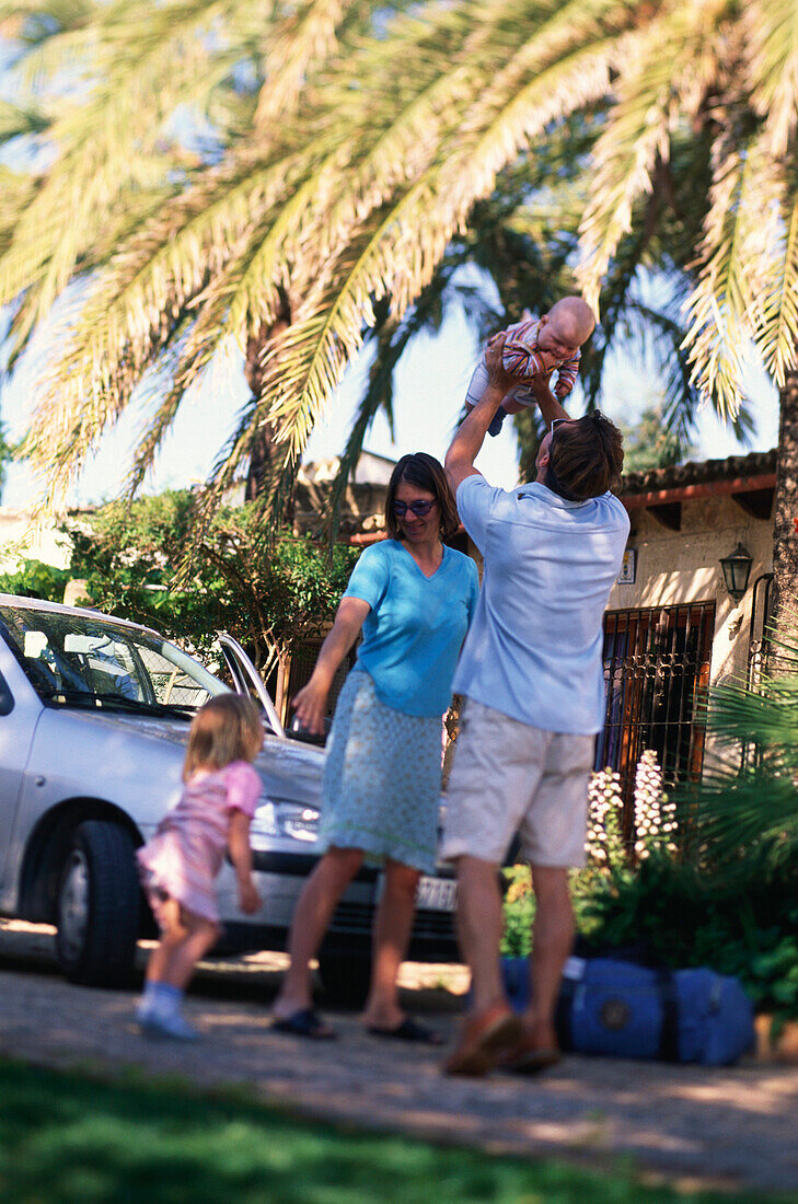 Family travelling, on holiday, car in the background, Holiday Appartment, Finca, Mallorca, Balearic Islands, Spain