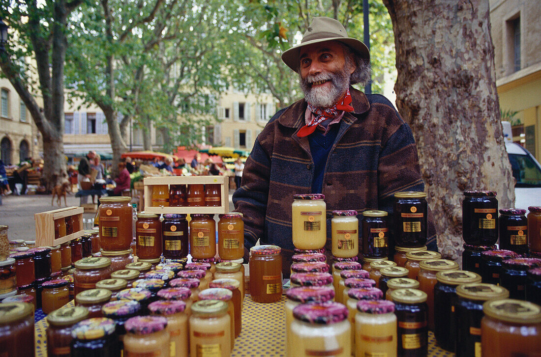 Local man selling honey at a market, Aix-En-Provence, Bouches-du-Rhone, Provence, France