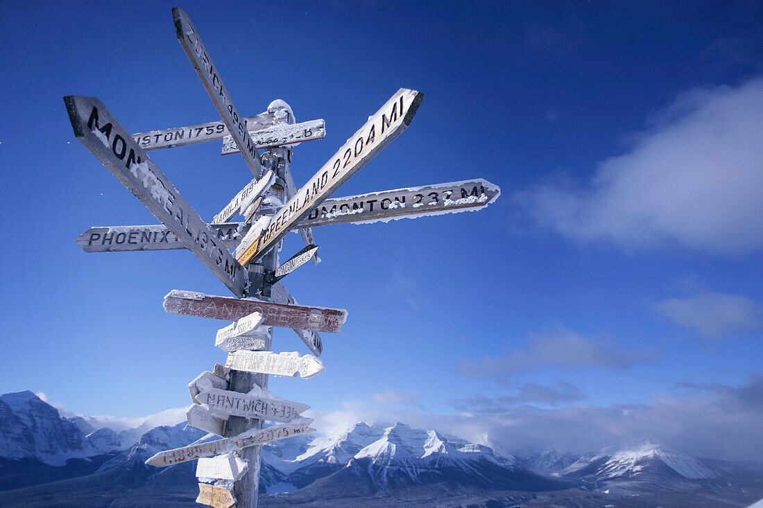 Sign post with distance plates, ski resort, lake louise, Alberta, Canada