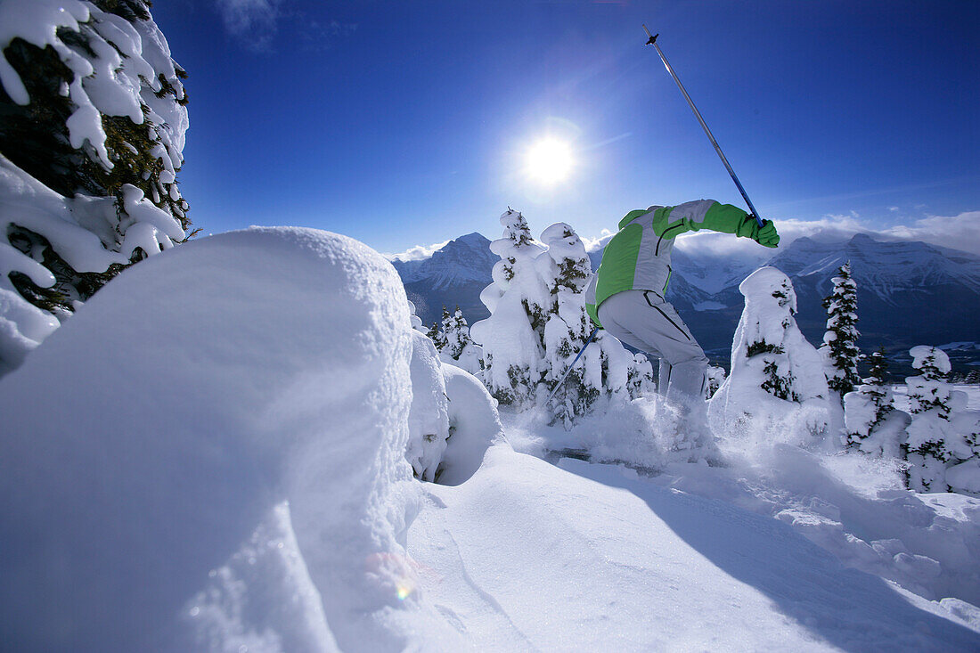 Skier in deep snow, Lake Louise, Alberta, Canada