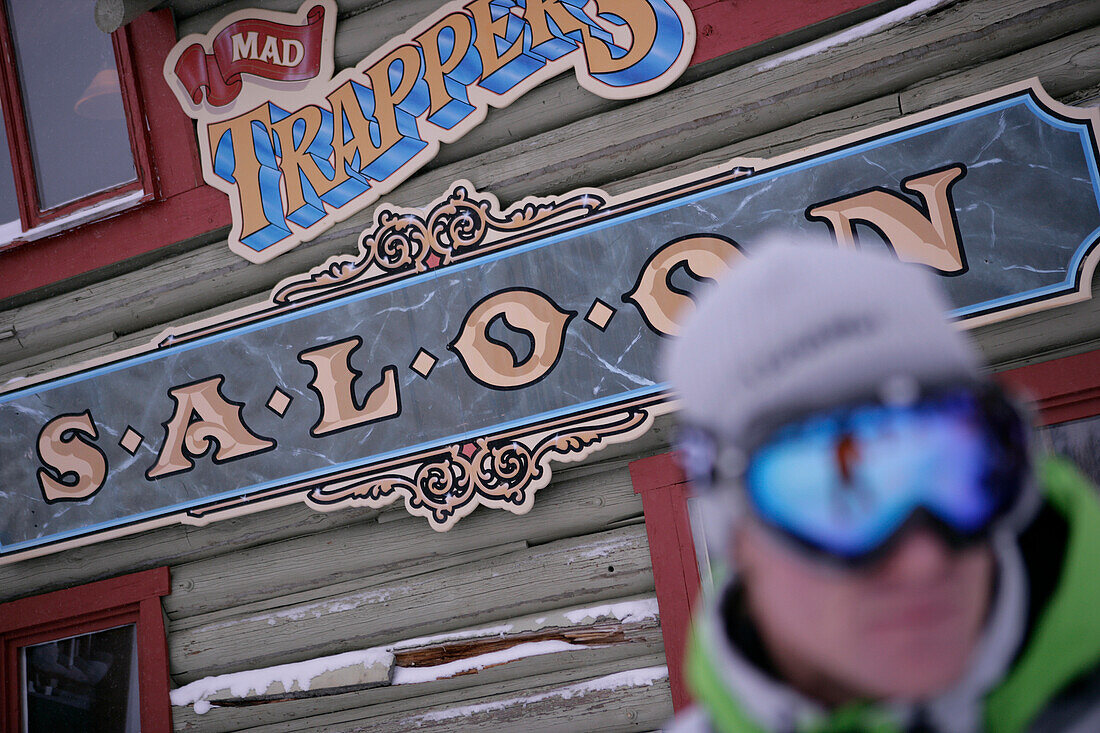 Skier in front of Mad Trappers Saloon, Ski Resort, Sunshine Village, Alberta, Canada