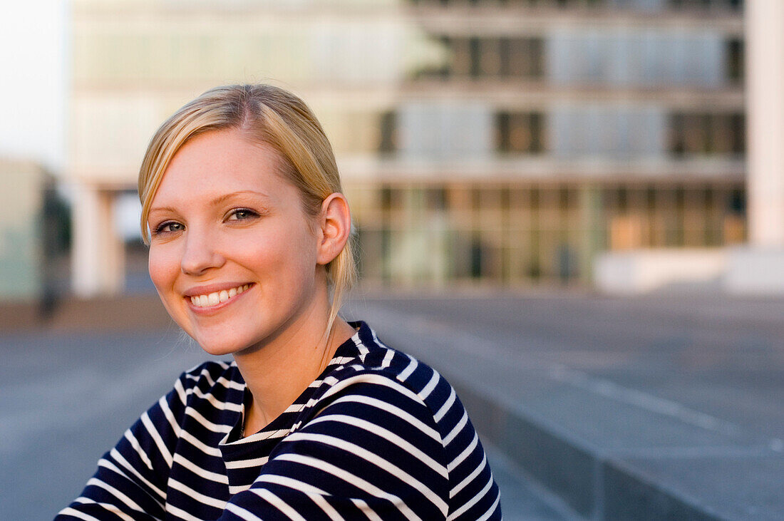 Portrait of smiling young woman, Luxembourg