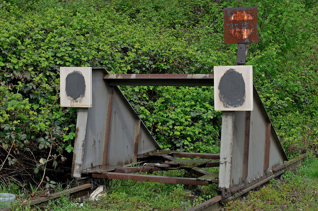 Overgrown buffer stop at the end of the track