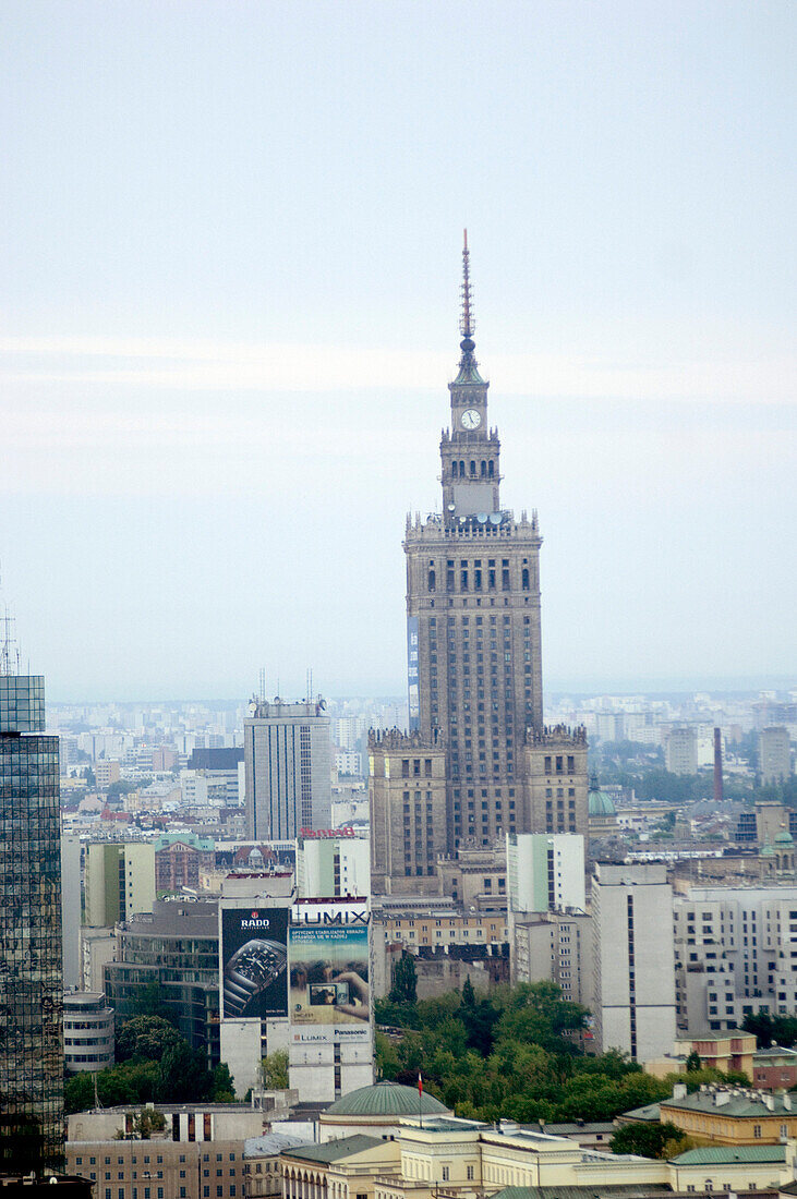 Historical buildings standing next to modern high rise buildings in the city, Warsaw, Poland