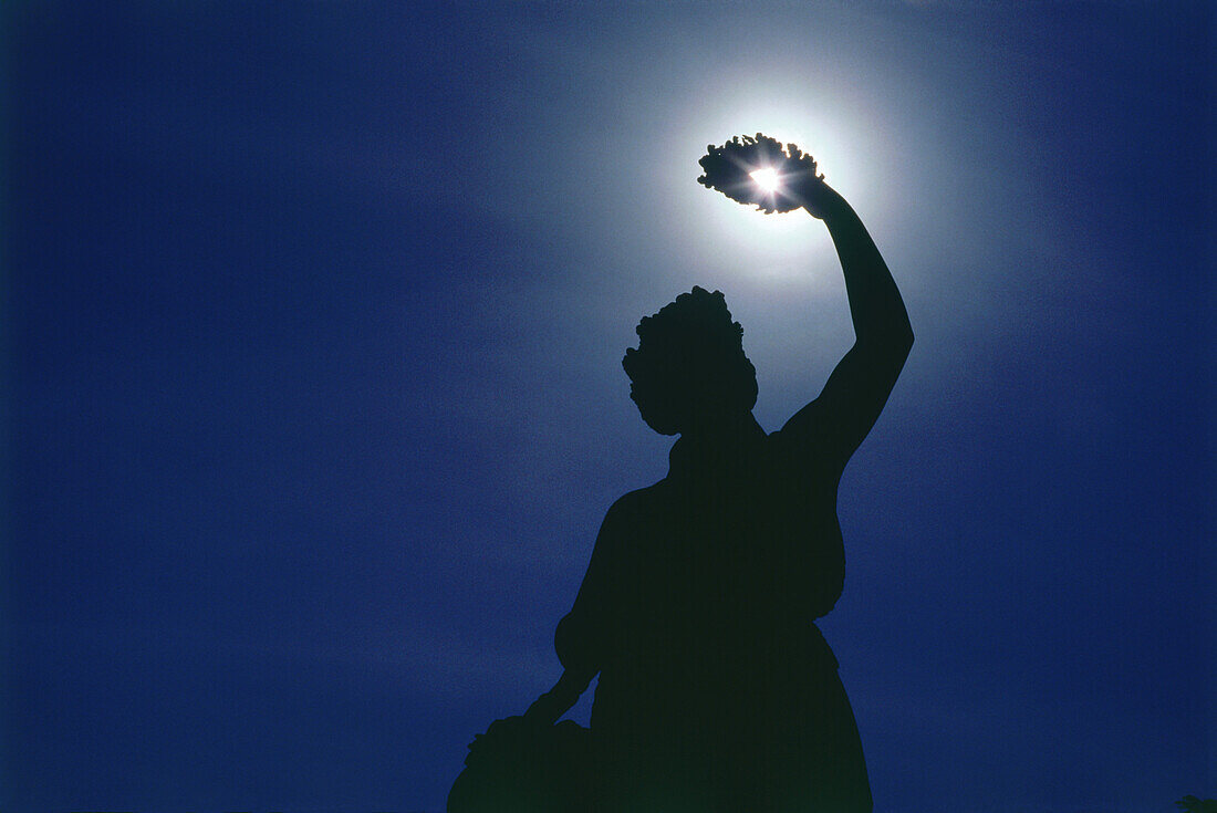 Silhouette of Bavara statue at night, Munich, Bavaria, Germany